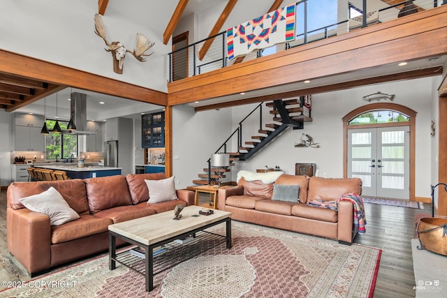 52619 Chumelina Ct, Kasilof, AK 99610 - living room with stairs, healthy amount of natural light, wood finished floors, french doors, and a towering ceiling