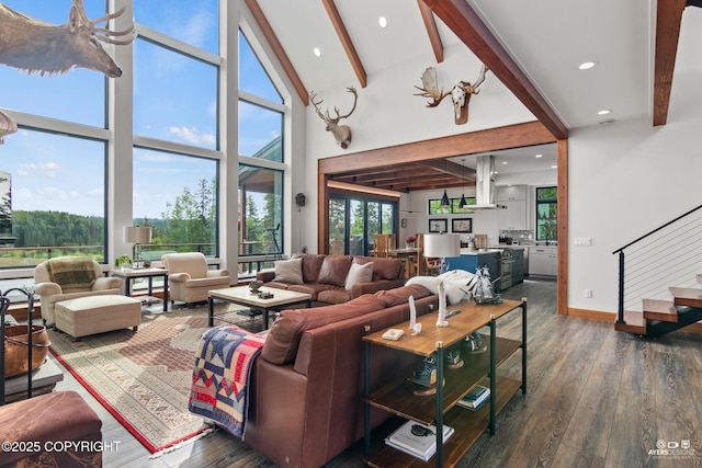 52619 Chumelina Ct, Kasilof, AK 99610 - living room featuring beamed ceiling, a high ceiling, wood finished floors, recessed lighting, and stairs