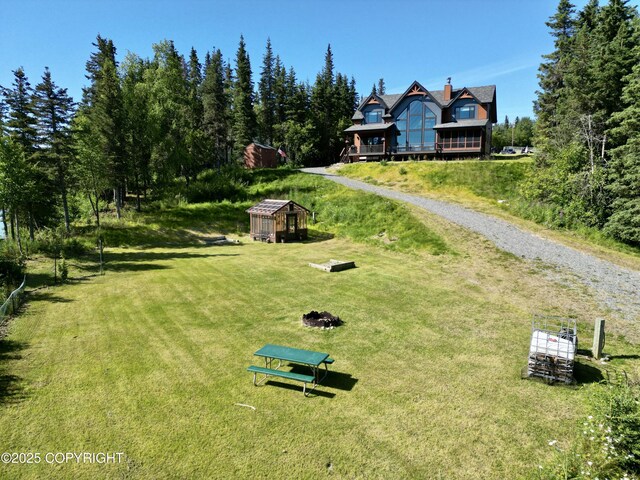 52619 Chumelina Ct, Kasilof, AK 99610 - view of home's community featuring a yard and an outbuilding