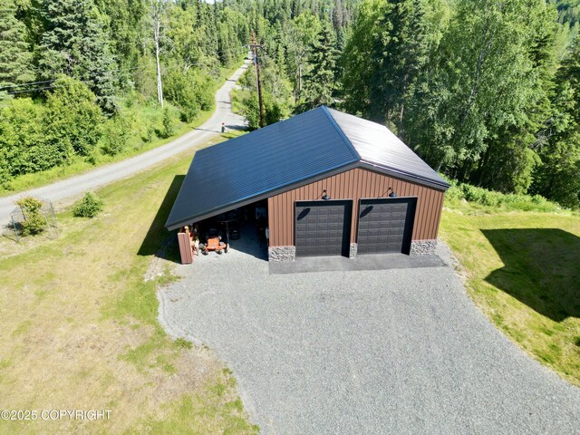 52619 Chumelina Ct, Kasilof, AK 99610 - detached garage with gravel driveway and a forest view