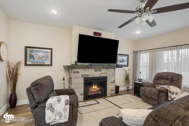 1630 S Corwin Ln, Wasilla, AK 99654 - living room featuring baseboards, a ceiling fan, wood finished floors, recessed lighting, and a fireplace