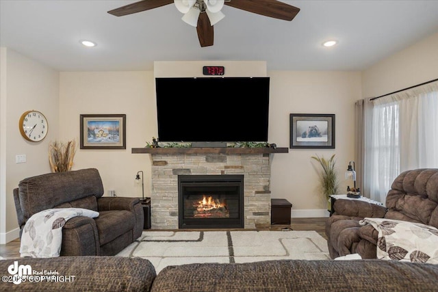 1630 S Corwin Ln, Wasilla, AK 99654 - living area featuring a ceiling fan, baseboards, wood finished floors, recessed lighting, and a fireplace