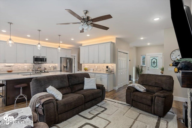 1630 S Corwin Ln, Wasilla, AK 99654 - living room with ceiling fan, recessed lighting, light wood finished floors, and baseboards