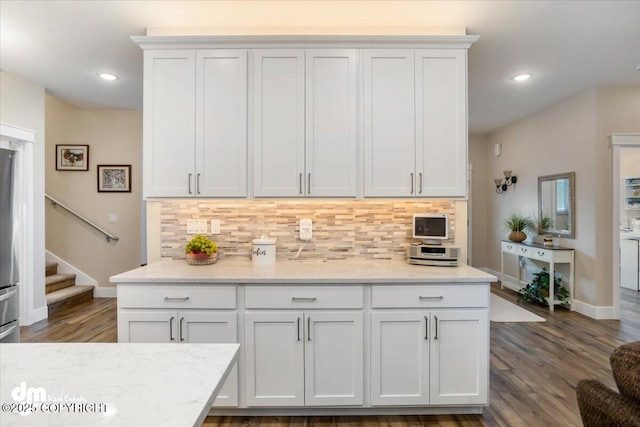 1630 S Corwin Ln, Wasilla, AK 99654 - kitchen featuring baseboards, tasteful backsplash, light stone countertops, and recessed lighting