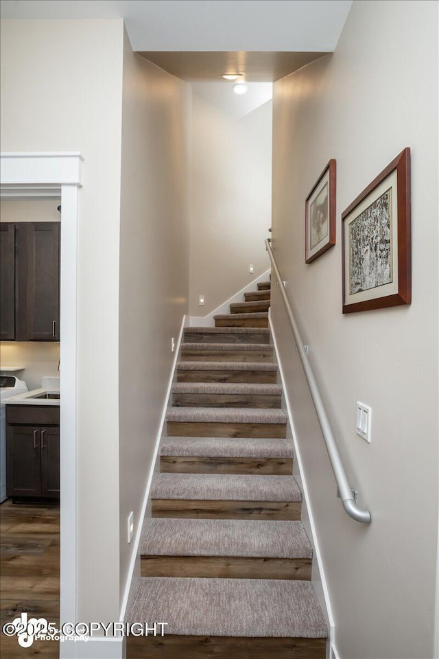 1630 S Corwin Ln, Wasilla, AK 99654 - staircase featuring wood finished floors and baseboards