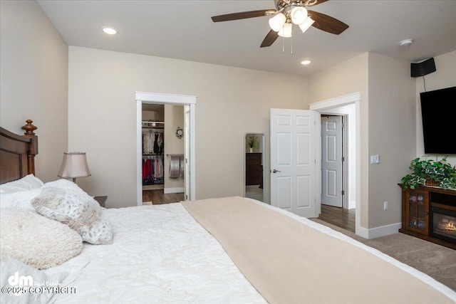 1630 S Corwin Ln, Wasilla, AK 99654 - bedroom with a walk in closet, baseboards, a ceiling fan, and recessed lighting