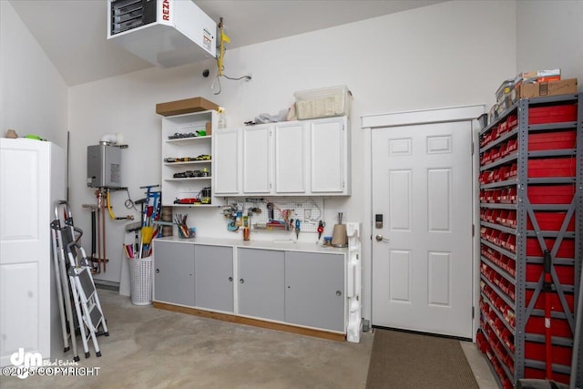 1630 S Corwin Ln, Wasilla, AK 99654 - garage featuring tankless water heater and a heating unit