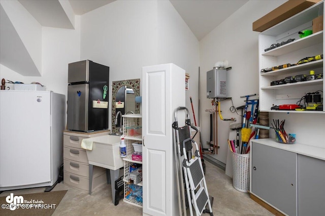 1630 S Corwin Ln, Wasilla, AK 99654 - miscellaneous room featuring concrete floors, water heater, lofted ceiling, and a sink