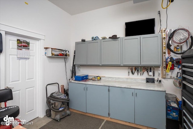 1630 S Corwin Ln, Wasilla, AK 99654 - kitchen with light countertops, blue cabinetry, and gray cabinetry
