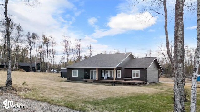 1630 S Corwin Ln, Wasilla, AK 99654 - view of front of property with a front lawn and a deck