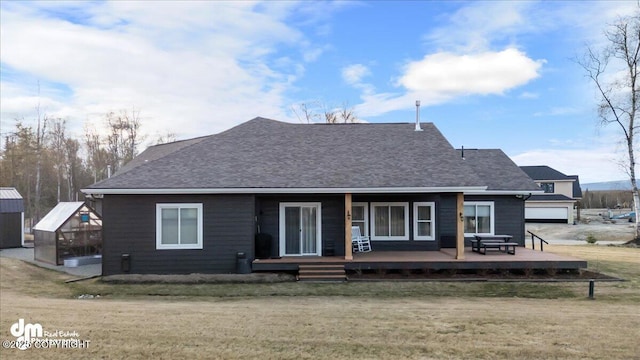 1630 S Corwin Ln, Wasilla, AK 99654 - back of house with an exterior structure, a lawn, an outdoor structure, and a shingled roof
