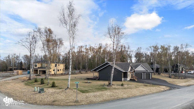 1630 S Corwin Ln, Wasilla, AK 99654 - view of front of property with asphalt driveway, a garage, and a front yard