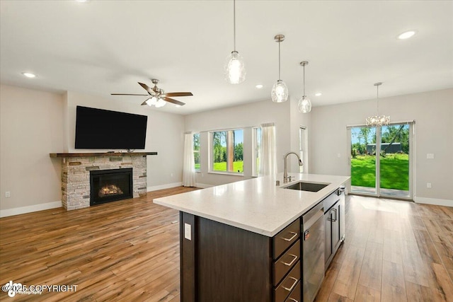 1630 S Corwin Ln, Wasilla, AK 99654 - kitchen featuring stainless steel dishwasher, healthy amount of natural light, a ceiling fan, light countertops, and recessed lighting