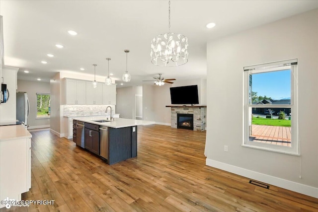 1630 S Corwin Ln, Wasilla, AK 99654 - kitchen with appliances with stainless steel finishes, light countertops, a ceiling fan, recessed lighting, and open floor plan