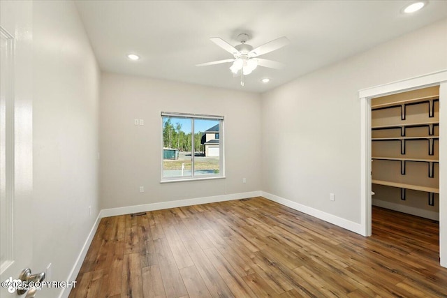1630 S Corwin Ln, Wasilla, AK 99654 - empty room with wood-type flooring, ceiling fan, and recessed lighting