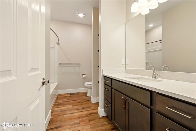 1630 S Corwin Ln, Wasilla, AK 99654 - full bathroom featuring vanity, wood finished floors,  shower combination, and recessed lighting