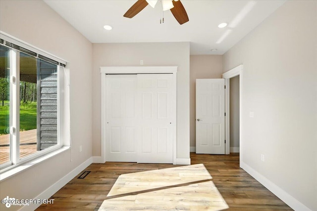 1630 S Corwin Ln, Wasilla, AK 99654 - unfurnished bedroom with a closet, wood finished floors, a ceiling fan, and recessed lighting