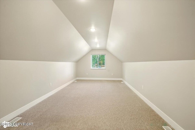 1630 S Corwin Ln, Wasilla, AK 99654 - additional living space with lofted ceiling, light carpet, and recessed lighting