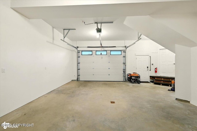 1630 S Corwin Ln, Wasilla, AK 99654 - garage featuring a garage door opener