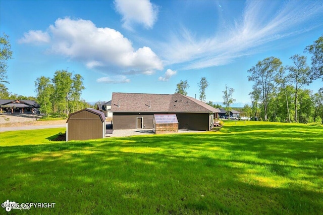 1630 S Corwin Ln, Wasilla, AK 99654 - back of property featuring a storage shed and a lawn