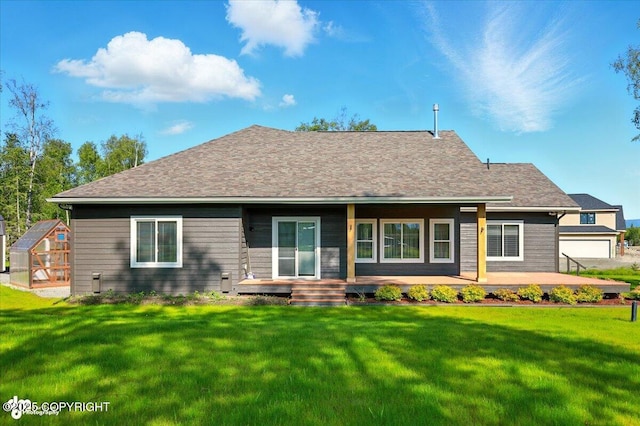 1630 S Corwin Ln, Wasilla, AK 99654 - rear view of house with a lawn, an exterior structure, a porch, and an outdoor structure
