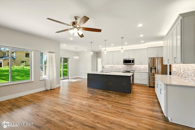 1630 S Corwin Ln, Wasilla, AK 99654 - kitchen featuring stainless steel appliances, recessed lighting, tasteful backsplash, light countertops, and ceiling fan