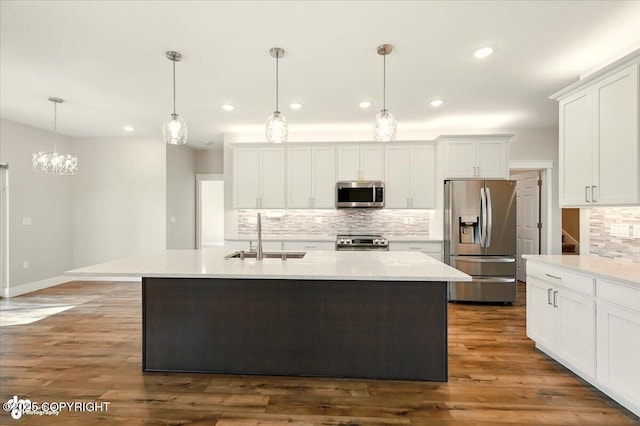 1630 S Corwin Ln, Wasilla, AK 99654 - kitchen featuring stainless steel appliances, tasteful backsplash, light countertops, and recessed lighting