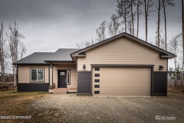6552 N Michelle Rae St, Wasilla, AK 99654 - view of front of house featuring a shingled roof, driveway, and an attached garage
