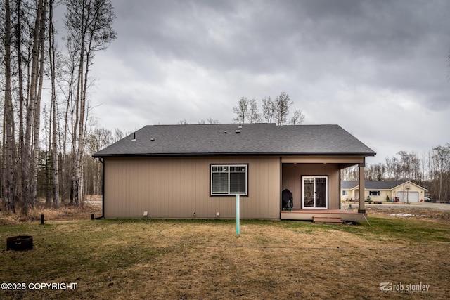 6552 N Michelle Rae St, Wasilla, AK 99654 - back of property with a yard and a shingled roof