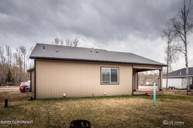 6552 N Michelle Rae St, Wasilla, AK 99654 - back of house featuring a lawn and a shingled roof