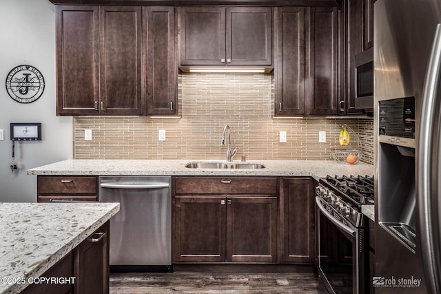 6552 N Michelle Rae St, Wasilla, AK 99654 - kitchen featuring appliances with stainless steel finishes, a sink, and dark brown cabinets
