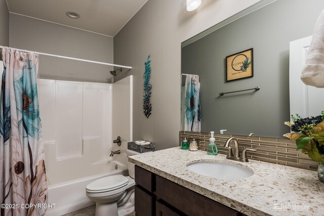 6552 N Michelle Rae St, Wasilla, AK 99654 - bathroom with decorative backsplash, vanity, shower / bath combination with curtain, and toilet