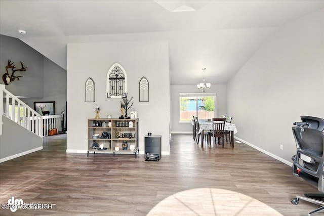 1320 S Felton St, Palmer, AK 99645 - interior space with vaulted ceiling, wood finished floors, baseboards, and a chandelier