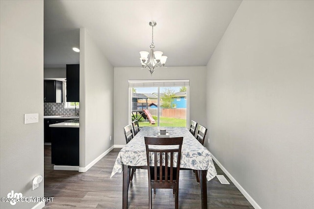 1320 S Felton St, Palmer, AK 99645 - dining space with a chandelier, wood finished floors, and baseboards