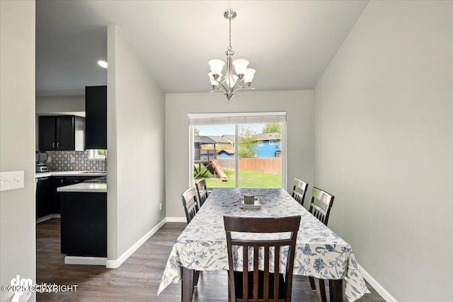1320 S Felton St, Palmer, AK 99645 - dining room with a chandelier, wood finished floors, baseboards, and lofted ceiling