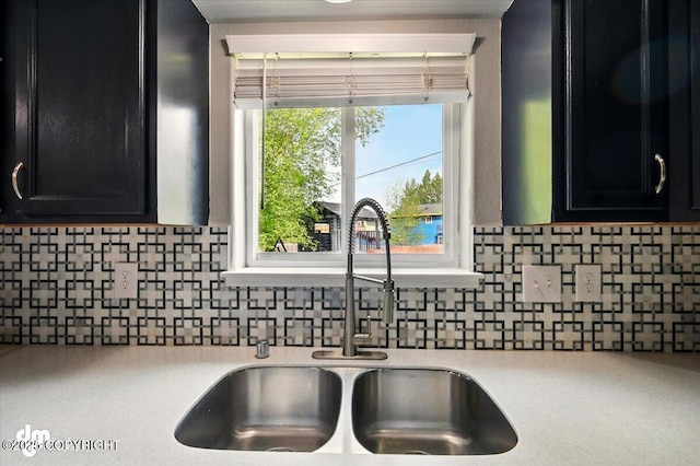 1320 S Felton St, Palmer, AK 99645 - kitchen view of a sink, dark cabinets, and light countertops