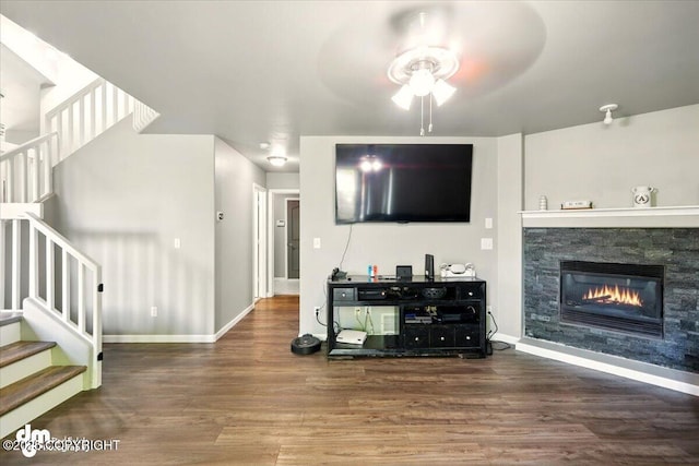 1320 S Felton St, Palmer, AK 99645 - living area featuring a ceiling fan, stairs, wood finished floors, and a fireplace