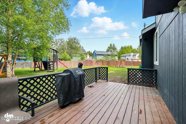 1320 S Felton St, Palmer, AK 99645 - wooden terrace with grilling area and a playground
