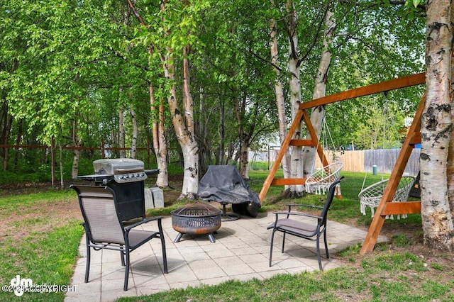 1320 S Felton St, Palmer, AK 99645 - view of patio / terrace featuring an outdoor fire pit and area for grilling