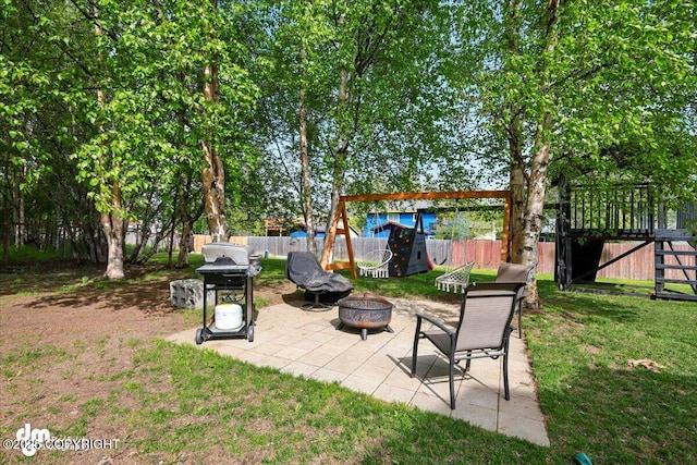 1320 S Felton St, Palmer, AK 99645 - view of yard featuring an outdoor fire pit and a patio area