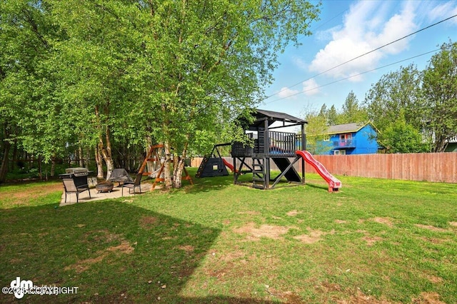1320 S Felton St, Palmer, AK 99645 - view of yard featuring a playground and a fire pit