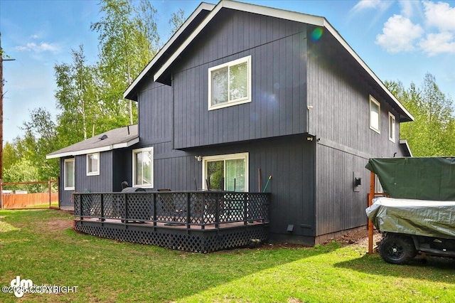 1320 S Felton St, Palmer, AK 99645 - back of property featuring a wooden deck and a lawn