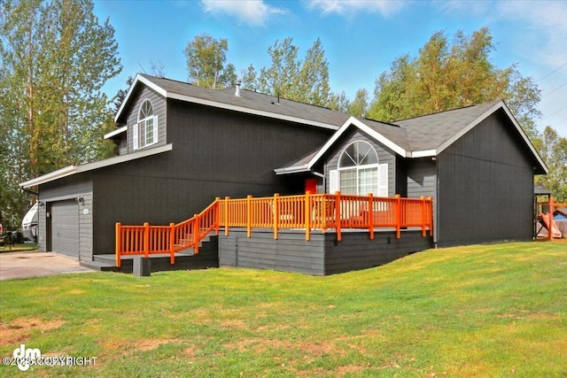 1320 S Felton St, Palmer, AK 99645 - back of house featuring a lawn and driveway