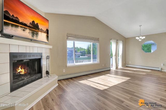 3233 Tayshee Cir, Anchorage, AK 99504 - unfurnished living room with a baseboard radiator, baseboard heating, lofted ceiling, wood finished floors, and a chandelier