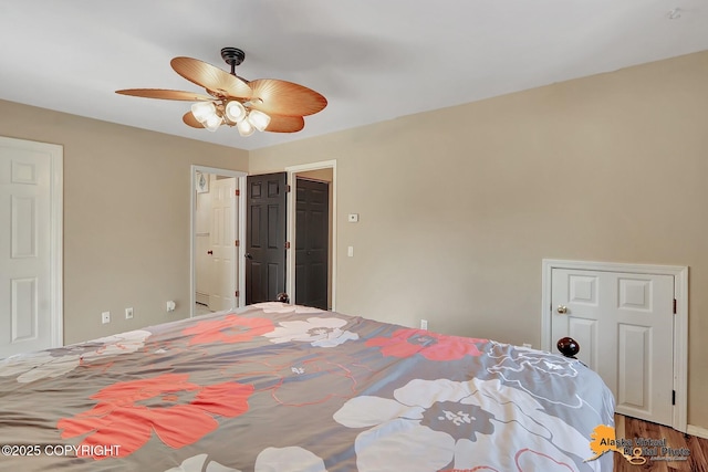 3233 Tayshee Cir, Anchorage, AK 99504 - bedroom with wood finished floors and a ceiling fan