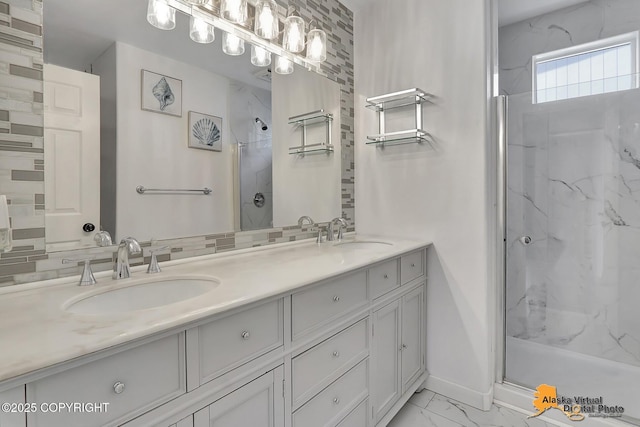 3233 Tayshee Cir, Anchorage, AK 99504 - bathroom featuring a marble finish shower, marble look tiles, double vanity, and baseboards