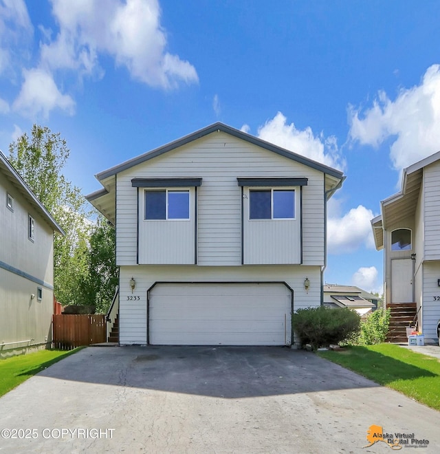 3233 Tayshee Cir, Anchorage, AK 99504 - view of front of home featuring an attached garage and concrete driveway
