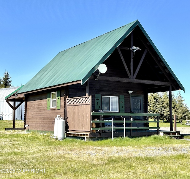 31795 Whiskey Gulch St, Anchor Point, AK 99556 - rear view of house featuring a lawn