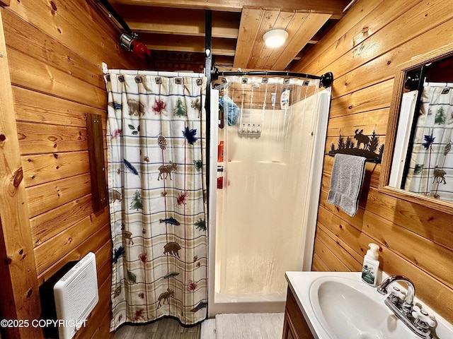 31795 Whiskey Gulch St, Anchor Point, AK 99556 - full bathroom featuring wooden walls, vanity, curtained shower, heating unit, and wood finished floors
