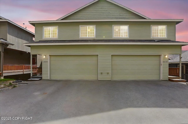20182 Eagles Nest Ct # 5B, Eagle River, AK 99577 - view of front of home with a garage and asphalt driveway